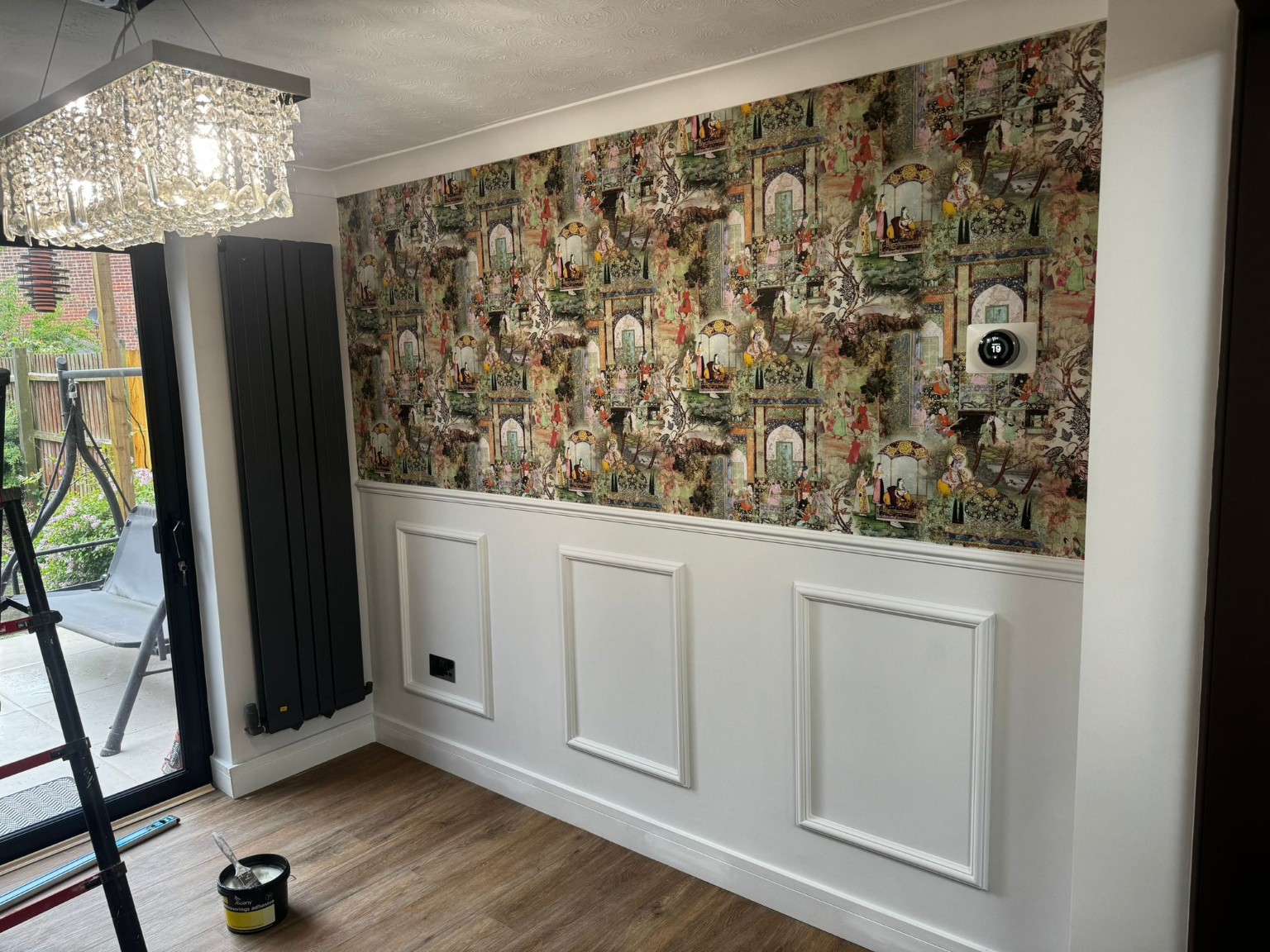 Wall panelling and wallpaper after finishing